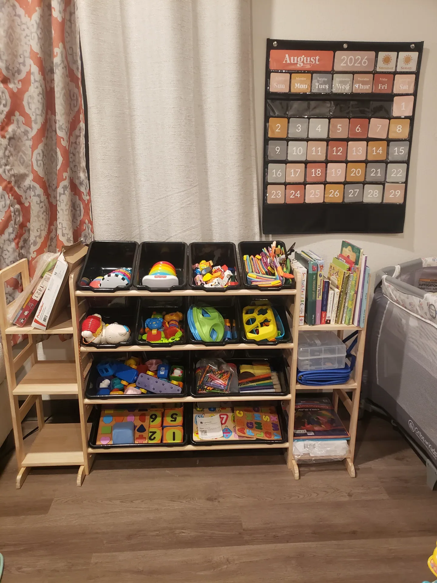 Organized shelves of toys, puzzles, books, and creative materials at T.L.C. Footprints